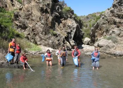 Sea kayakers participating in environmental cleanup