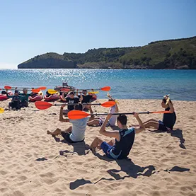 Group learning basic kayaking skills on Costa Brava