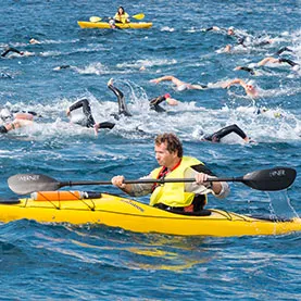 Swimming support during guided kayak excursion